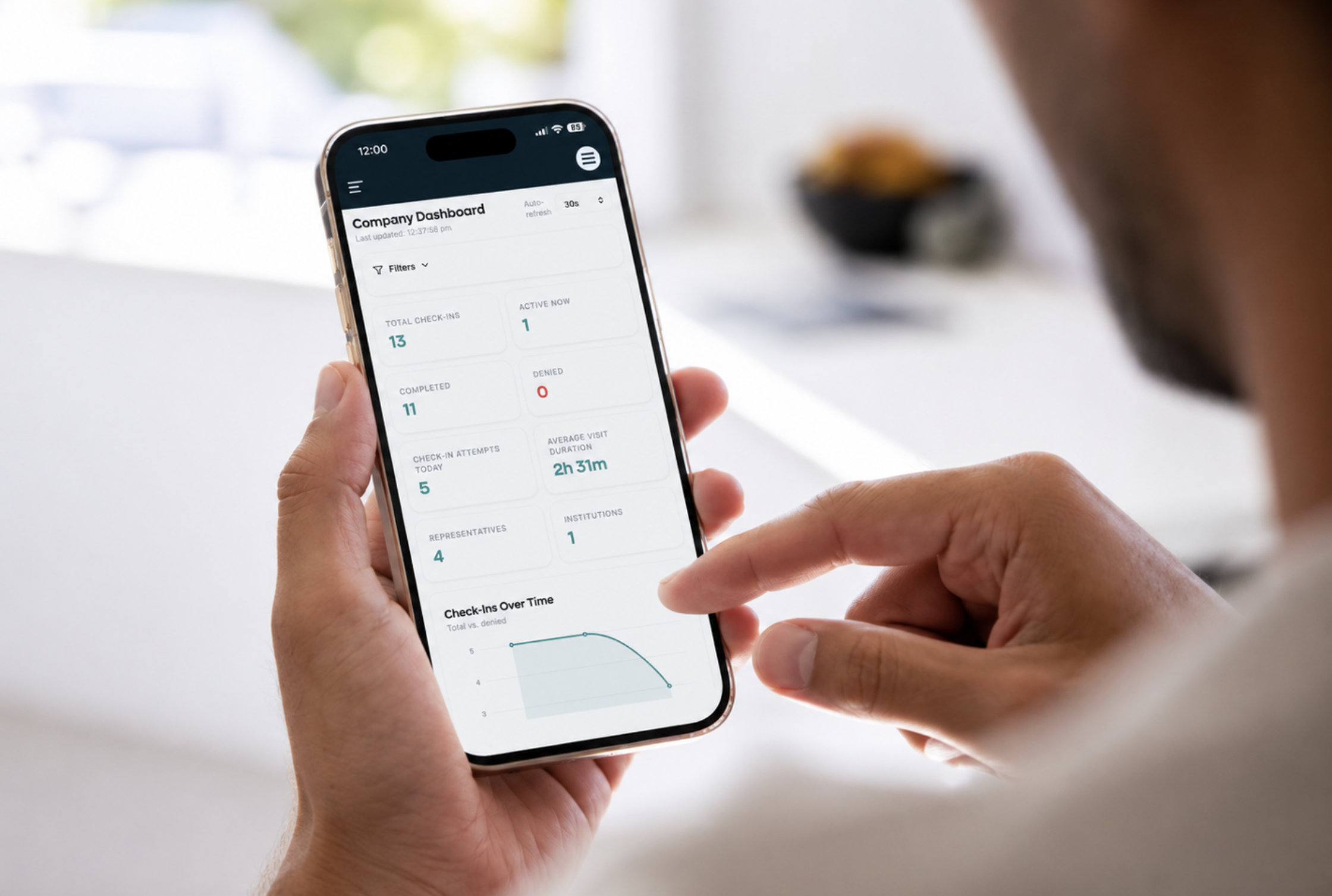 Healthcare industry professional reviewing the OneCredential company dashboard on a mobile phone